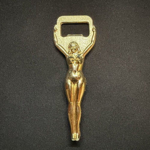 Vintage metal bottle opener with golden female figure