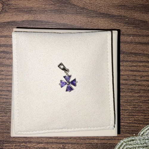 Small purple cross charm like new, no chain