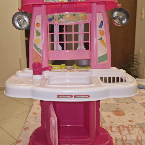 Children's kitchen playset like new with pot, knife, and fork
