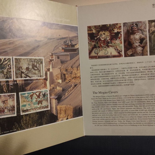 Collectible gold-bound volume with China stamps and photos