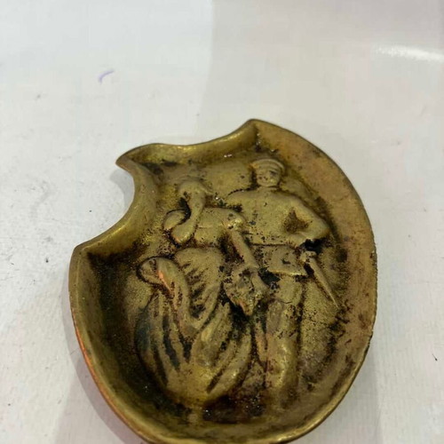 Vintage brass ashtray with embossed World War I scene used