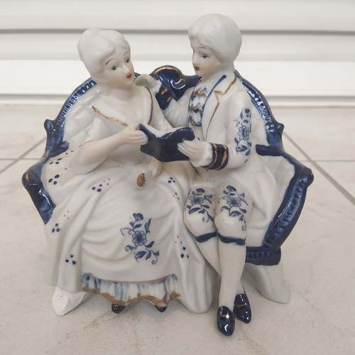 Vintage couple figurine reading on sofa rococo style like new