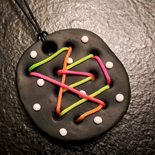 Handmade psychedelic fluo pendant with colorful cord on black base like new