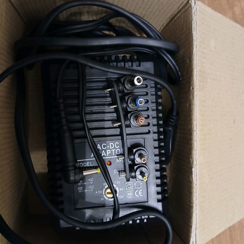 Universal AC/DC adapter new, adjustable power supply with multiple plugs