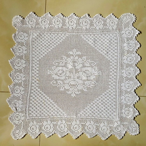 Handmade knitted square used with cotton thread