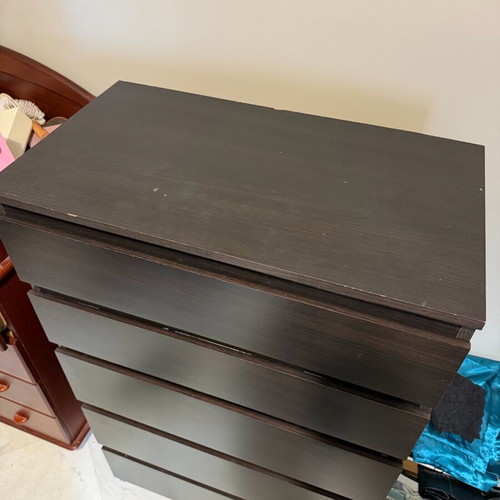 Dark brown wooden chest of drawers used with minimal wear