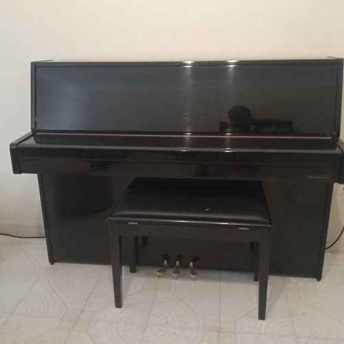 Eterna Yamaha upright piano like new with storage bench