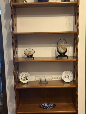 Wooden showcase shelf used with classic curved sides