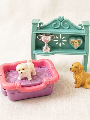 Lot of dog figures and accessories with shelf, bed, and cup