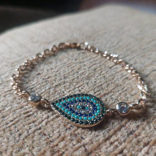 Gold bracelet new with eye and blue, turquoise, white stones