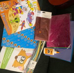 Craft supplies like new with colored sheets, red glitter foil, and UHU glue