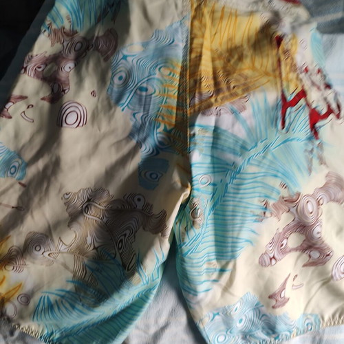Aggressive men's swim shorts size L like new, multicolor tribal print
