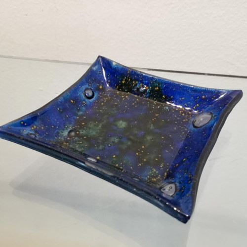 Decorative plate used, blown glass blue with green and yellow elements