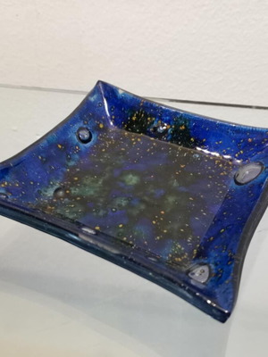 Decorative plate used, blown glass blue with green and yellow elements