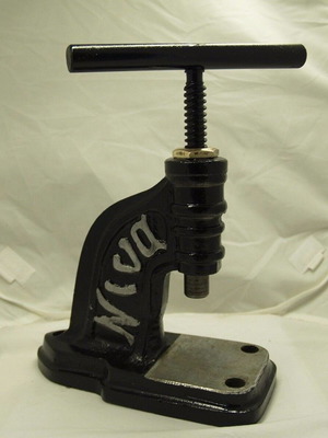 Vintage Greek button press used with NINA marking