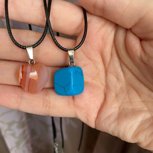 Pack of two crystal necklaces new with black cord unisex