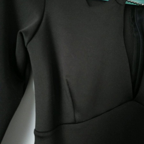 Black dress size M with open neckline, unused
