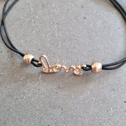 Love bracelet new with adjustable black and gold elastic