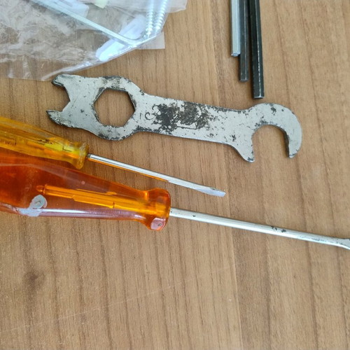 Various tools set used with 2 screwdrivers, 4 allen keys, screws and nails