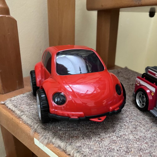 Toy cars, some unused, plastic and metal Mini Cooper