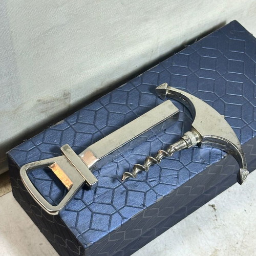 Vintage bottle opener and corkscrew anchor design used