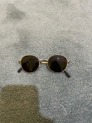Round glasses used, black, with flawless lens