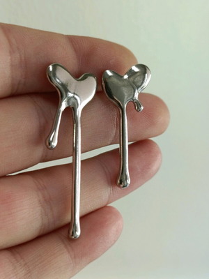 Steel heart asymmetric women's earrings new