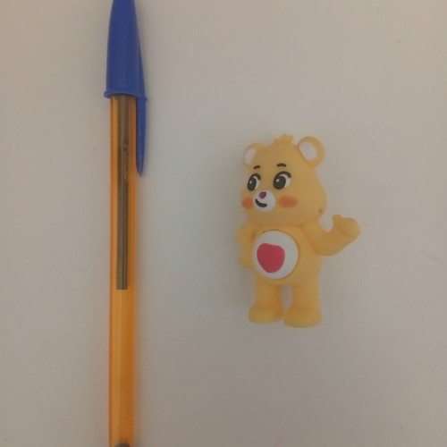 Care Bears Yellow Love-A-Lot Bear figure used with red heart