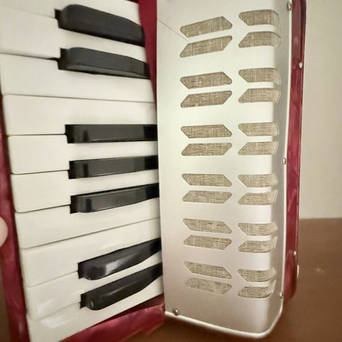 Children's accordion used, red with blue and red bellows
