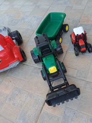Set of 3 children's plastic vehicles: green tractor with loader and trailer, red truck, small red and black tractor