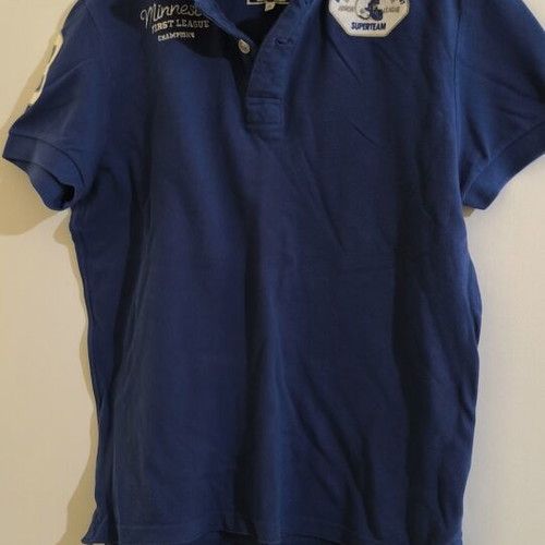 Camaro blue polo shirt with Minnesota First League Champions embroidery