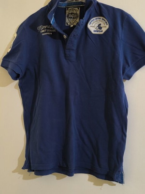 Camaro blue polo shirt with Minnesota First League Champions embroidery