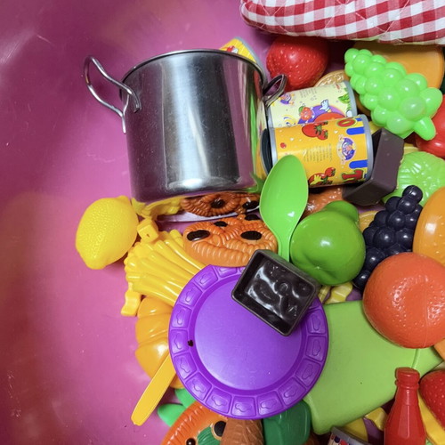 Children's toys used with plastic kitchen items, fruits, vegetables