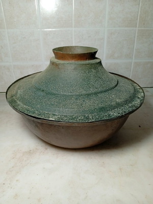 Traditional copper pot used, known as tenzeres or charani