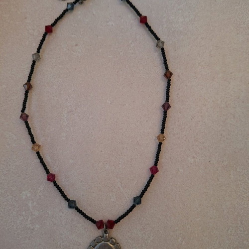 Necklace black with colorful stones and embossed face vintage like new