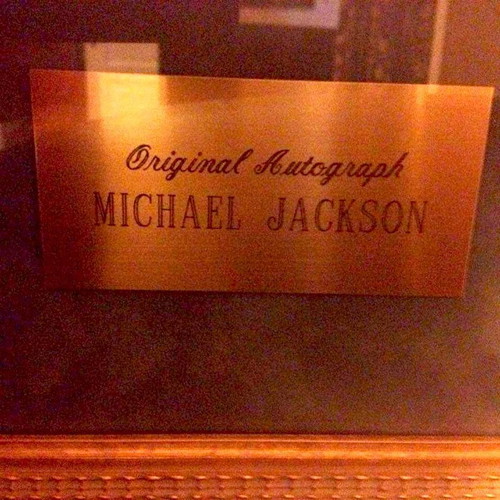 Michael Jackson autograph used in framed glass display