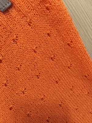 Knitted top with eyelet pattern, orange, size M