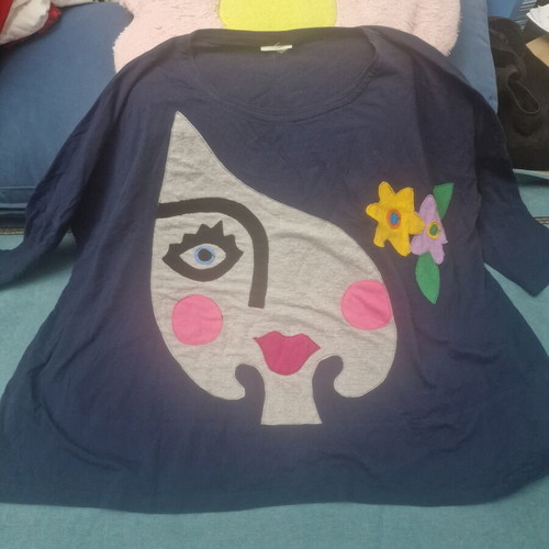 Blue blouse XXL like new with artistic abstract face design