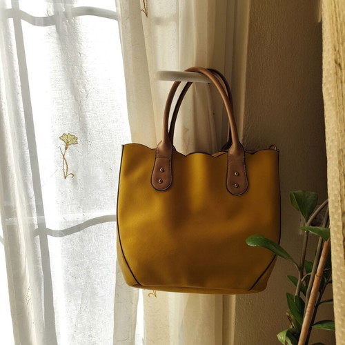 Yellow handbag used with beige details