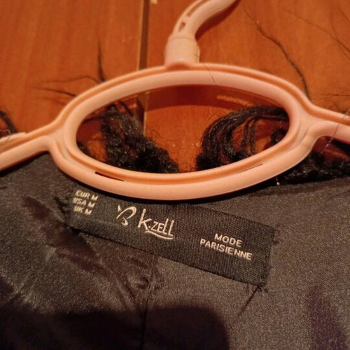 Synthetic fur like new, black with silver details, size M