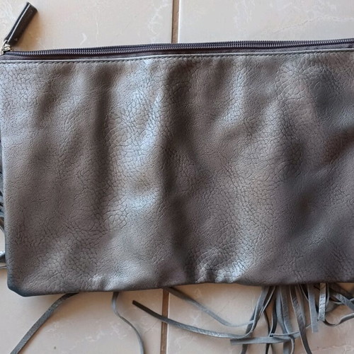 Grey faux leather fringe clutch bag like new