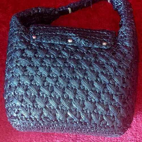 Handmade black raffia handbag used with silver turn-lock clasp