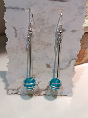 Earrings with blue bead and spiral made of aluminum wire made to order