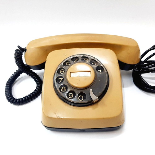 Vintage rotary phone used, beige, 1970s