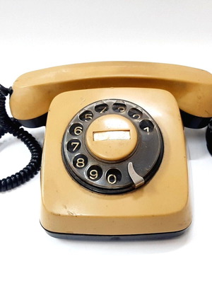 Vintage rotary phone used, beige, 1970s