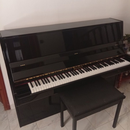 Piano used, black wall Steinbach