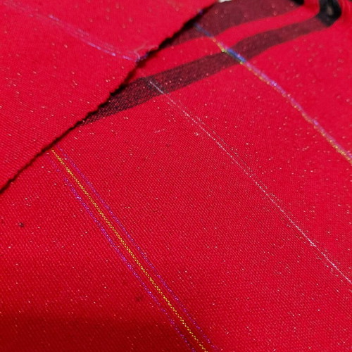 Traditional cotton fabric on loom, new, red with black stripes