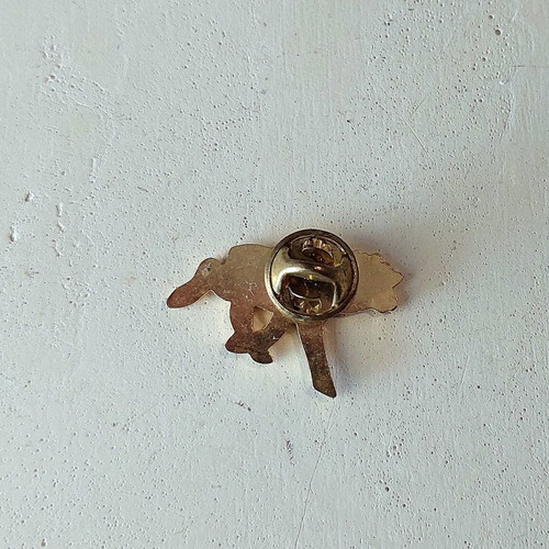 Black reindeer pin, gold tone