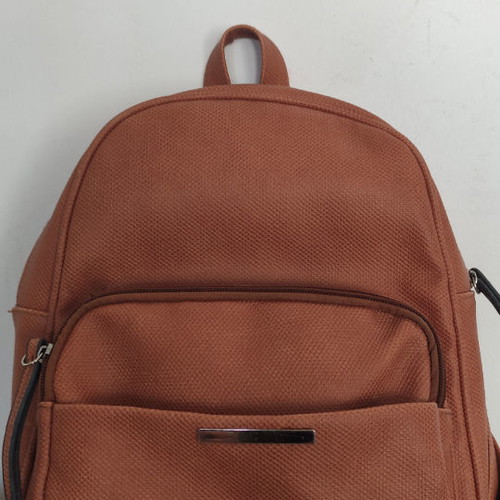 Back pack tan used with internal and external pockets