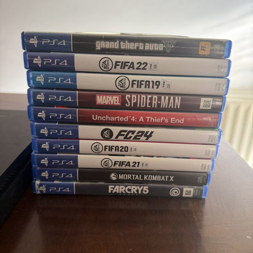 PlayStation 4 Slim 500GB used with 2 controllers and 11 games